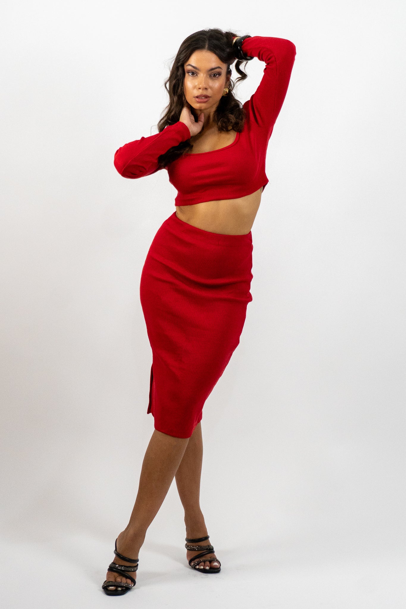 Woman wearing a red outfit on a white background