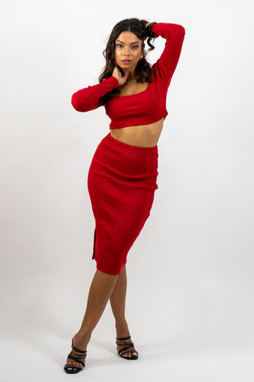 Woman wearing a red outfit on a white background