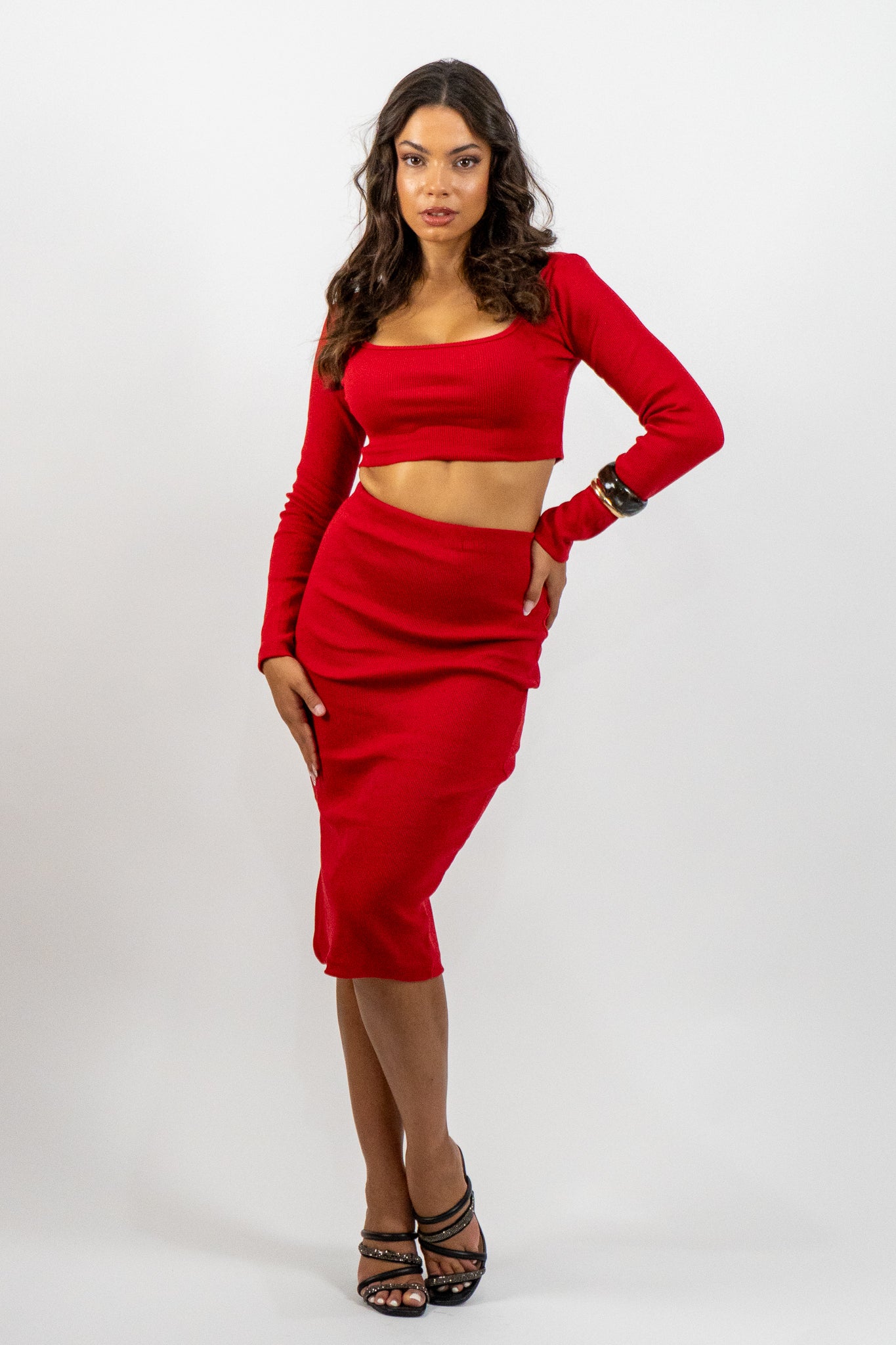 Woman wearing a red outfit on a white background