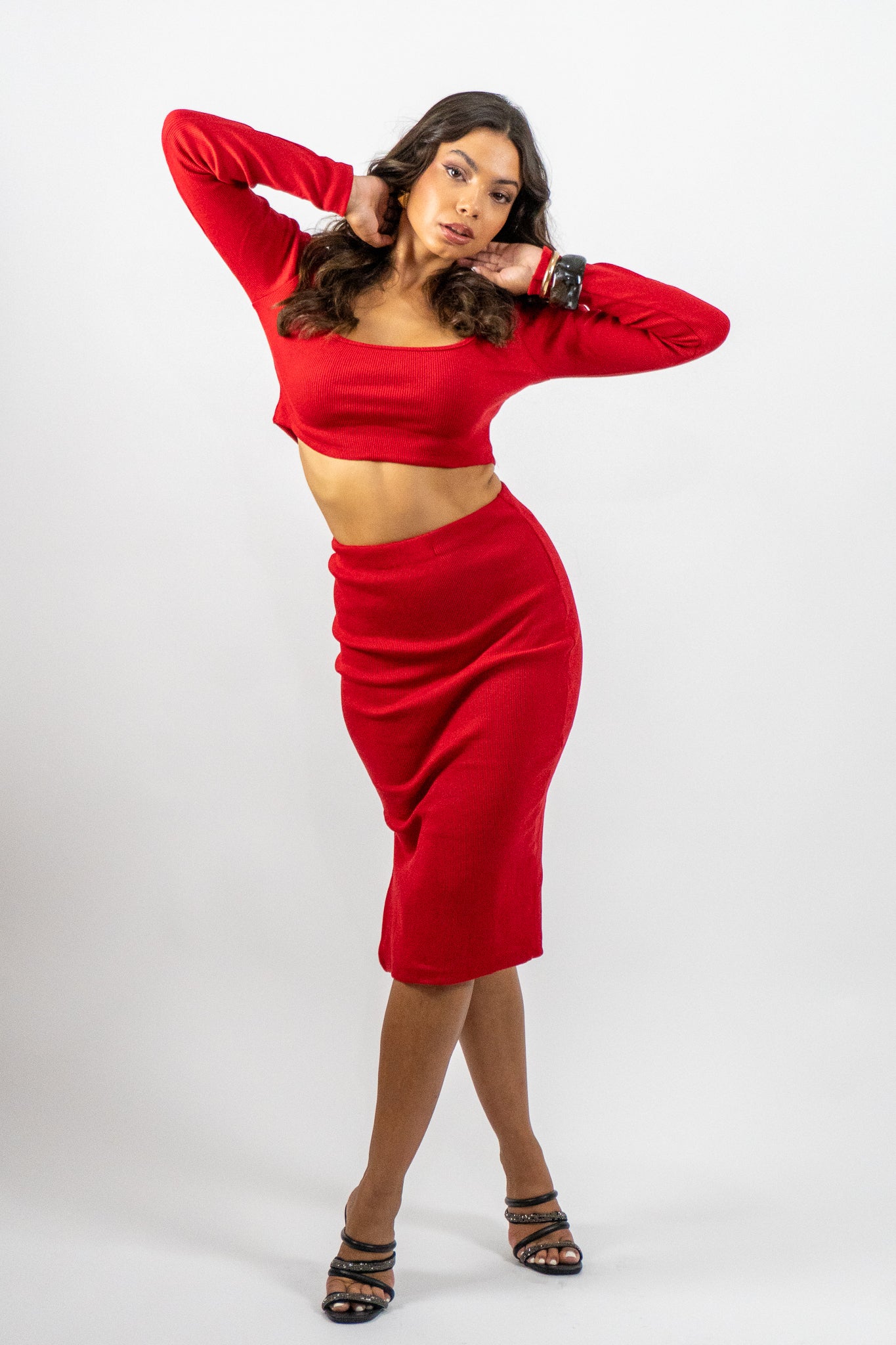Woman wearing a red outfit on a white background